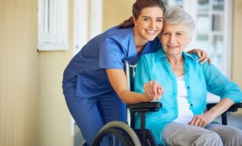 Portrait, caregiver or old woman in a wheelchair in hospital helping an elderly patient for support in clinic. Happy, medical or healthcare social worker talking to a senior person with a disability.